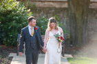 wedding at Champney Treasure House Beverley -  the bride and groom walk hand in hand in the gardens