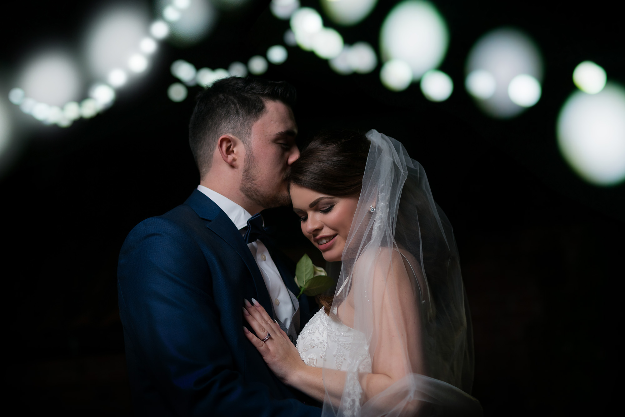 romantic shot of Bride and groom with fairy lights at Lazaat hotel Cottingham windter wedding